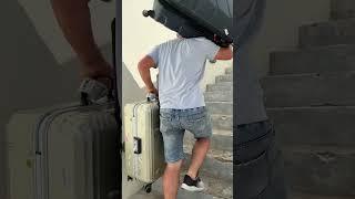 Super strong hotel porter in Santorini carrying at least 100 lbs.