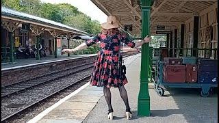 Vintage dress pole dancing whilst waiting for the train