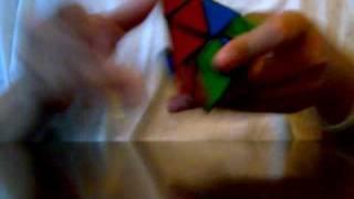 Kyle solves a Pyraminx