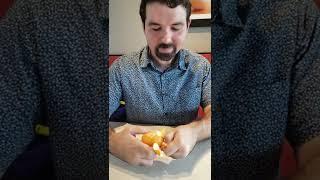 Demi properly eats an orange with MissRubik's help