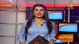 Woman Arab TV Presenter in Blue Blouse satin yes or no