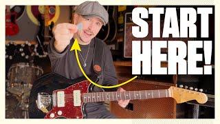 How to hold the guitar, pick strings and fret your first note! Beginners guitar lesson #1