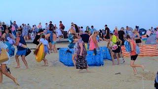 People run away from the beach on the Baltic Sea in Poland - Typical weather on vacation