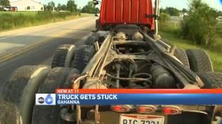 Stuck Truck: Dump Truck Bed Wedged Under Overpass