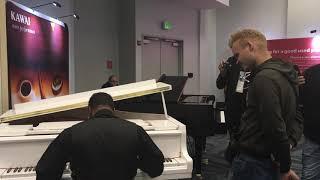 Jesus Molina watching Kris Nicholson play ragtime piano at NAMM 2020