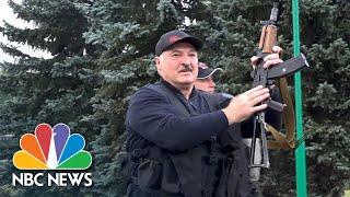 Lukashenko Arrives In Minsk Wielding Assault Rifle As Thousands In Belarus Protest | NBC News NOW