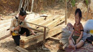 Single mother is in the process of chiseling the wooden house