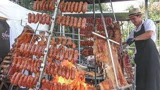 Tons of Cuban Meat Roasted on Pyramidal Grills. Street Food Festival in Italy