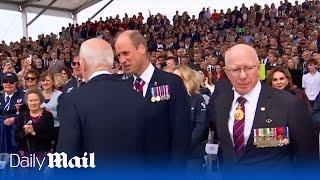 Moment Prince William and Joe Biden meet at D-day commemoration
