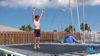 Teaching a Somersault (flip) on the Trampoline.