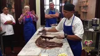 Hand tempering chocolate demonstration during Chocolate Making classes at Mahogany Chocolate