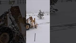 City loader snow plowing going down