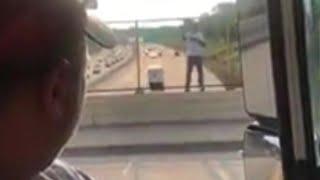 Delivery Men Lure Stranger From Bridge Ledge With Case of Beer