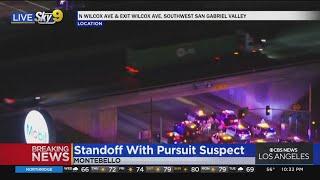 Pursuit suspect stops under 60 Freeway overpass
