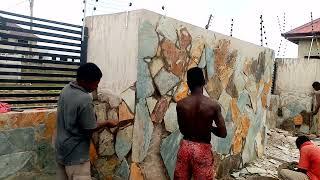 Installation of flat stone in Ghana the best way to prevent ur building from damp area at dawhenya