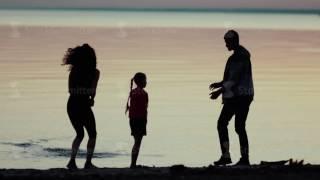 Family on nature. The family on the beach. Family at sunset