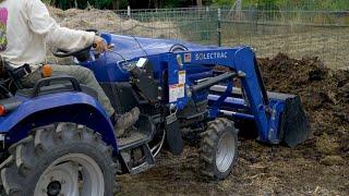 Solectrac Electric Tractor Mixing Compost