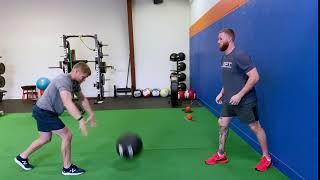 Split Stance Partner Overhead Med Ball Catch to Stomp