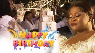 Obofowaa cuts her birthday cake with husband Rev. Obofour, Bishop Obinim and other men of God.