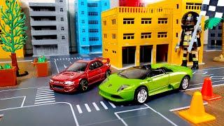 Car toys racing in diorama village