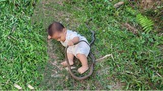 single mother has to carry her baby on her back all day to work to earn money to buy milk