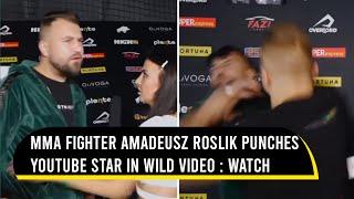 MMA fighter Amadeusz Roslik sucker-punches YouTube star in wild interview