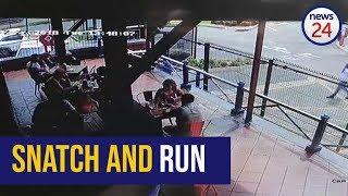 WATCH: Criminal snatches phone out of man's hand at a restaurant