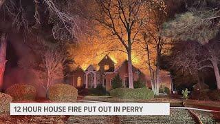 Massive house fire in Perry has fire department working for over 12-hours, assistant fire chief says