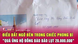 Điều bất ngờ bên trong chiếc phong bì dán kín, ghi dòng chữ "quà ủng hộ đồng bào bão lụt 20.000.000"