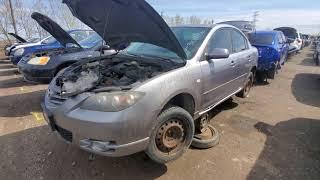 Junkyard Hoopties- Your typical Grey Rusted Mazda 3