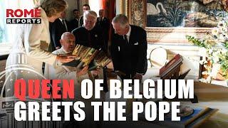 Queen of Belgium wears white to greet Pope Francis