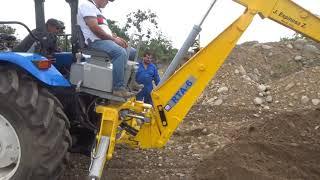 Retroexcavadora a tractor agrícola