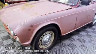 1963 TRIUMPH TR4 SURREY TOP CONVERTIBLE. ORIGINAL SIGNAL RED WITH BLACK TRIM. 4-SPEED, DISC WHEELS.