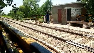 karkarm express  is passing from jahanian canal phatak # pakrailways it passing with great speed