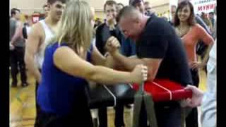 Armwrestling.Alina Samotoy and bodybuilder