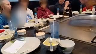 Spraying Sake (Rice Wine) into the mouths of patrons