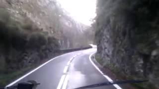 OurTour Drive Their Hymer Motorhome Through a Gorge in The Picos Mountains, Spain