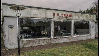 Abandoned vintage cars left to rot in an old show room