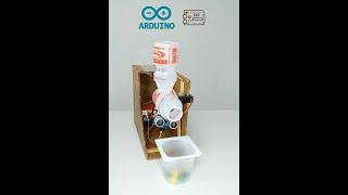 Project with ARDUINO UNO! M&Ms Chocolate Dispenser made with Yakult jars.