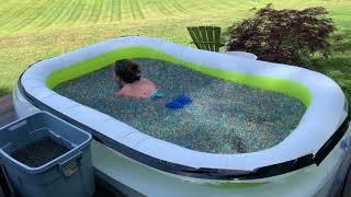 Swimming in water beads