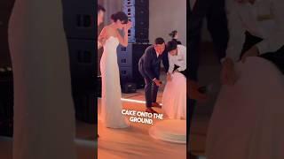 This waiter dropped their expensive wedding cake 