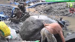 Old Man Breaking The Big Rocks By Hand Chisels