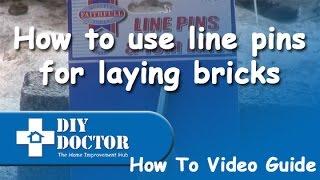 Using line pins for laying bricks