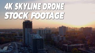 Drone Stock Footage In 4K Ascending Up Over An Urban Sunset