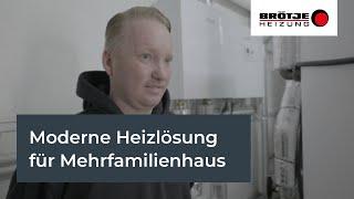 Hybridheizung aus Wärmepumpe und Gaskessel beheizt Mehrfamilienhaus nach energetischer Sanierung