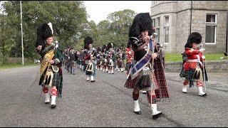 Massed Pipes and Drums of the Scottish Highlands line up ready for march to 2022 Braemar Gathering