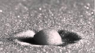 Raindrop Impact on a Sandy Surface