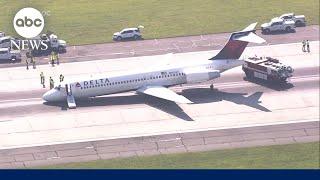 Delta flight makes emergency landing without gear