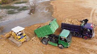 Watch as 5-Ton dump trucks pouring soil for the Komatsu D37P dozer and deleting a pond