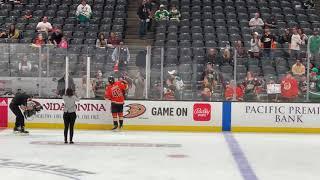 Trevor Zegras gives stick to a fan before the game